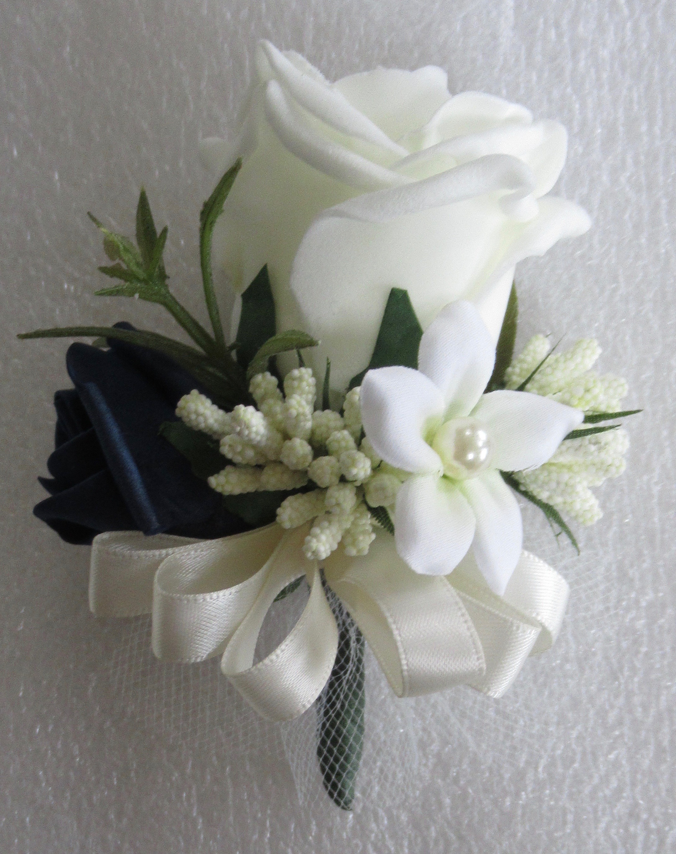 Ivory & Navy Blue Corsage with a pearled Stephanotis